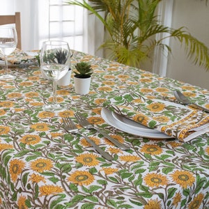 Mustard Yellow Cotton and green Indian Block-print Tablecloth with beautiful Sunflower design spread on a wooden table
