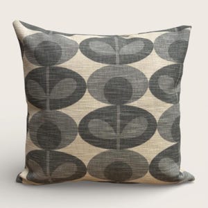May include: Square throw pillow with a repeating pattern of gray oval shapes with a leaf-like design on a beige background. The pillow has a textured appearance, suggesting a linen or similar fabric. The design is symmetrical and modern.