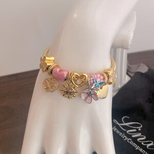 Linx Yellow Gold Snake Chain Bracelet with Gold and Pink Charms