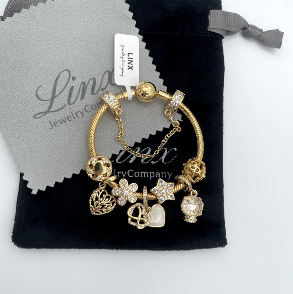 Linx Yellow Gold Snake Chain Bracelet with Gold Charms and safety chain