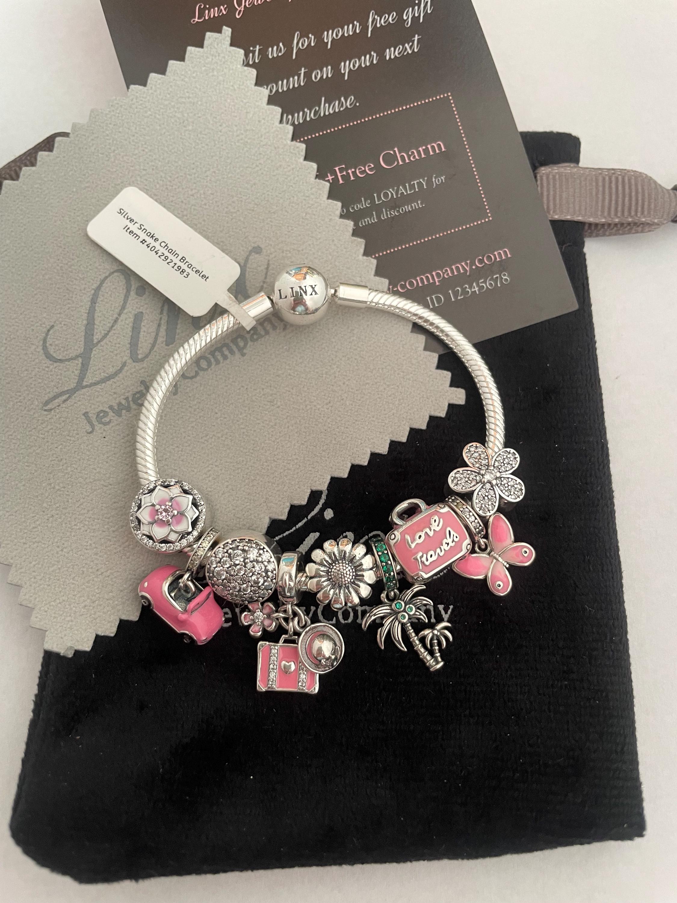 Linx Silver Snake Chain Bracelet With Pink Travel Themed Charms