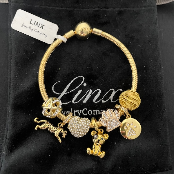 Linx Yellow Gold Snake Chain Bracelet with Gold Silver and Zircon Themed Charms