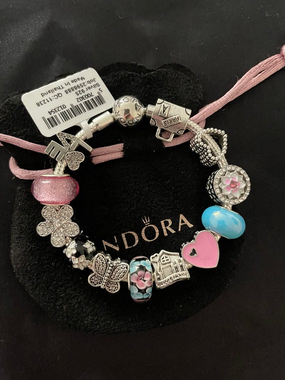 Pandora Bracelet With Pink Blue and Black Themed Charms 