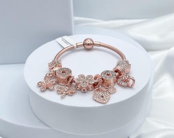 Pulsera Linx de cadena de serpiente de oro rosa con dijes de circonitas cúbicas