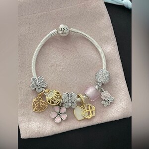 Linx Snake Chain Bracelet with Gold Silver and Pale Pink Themed Charms