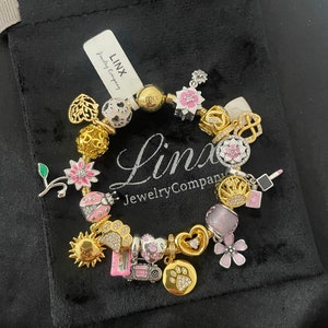 Linx Yellow Gold Bracelet with Pink Silver and Gold Themed Charms