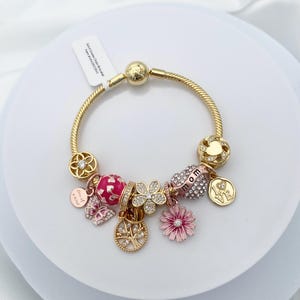 Linx Yellow Gold Snake Chain Bracelet with Silver Rose Gold and Yellow Gold Mom Themed Charms