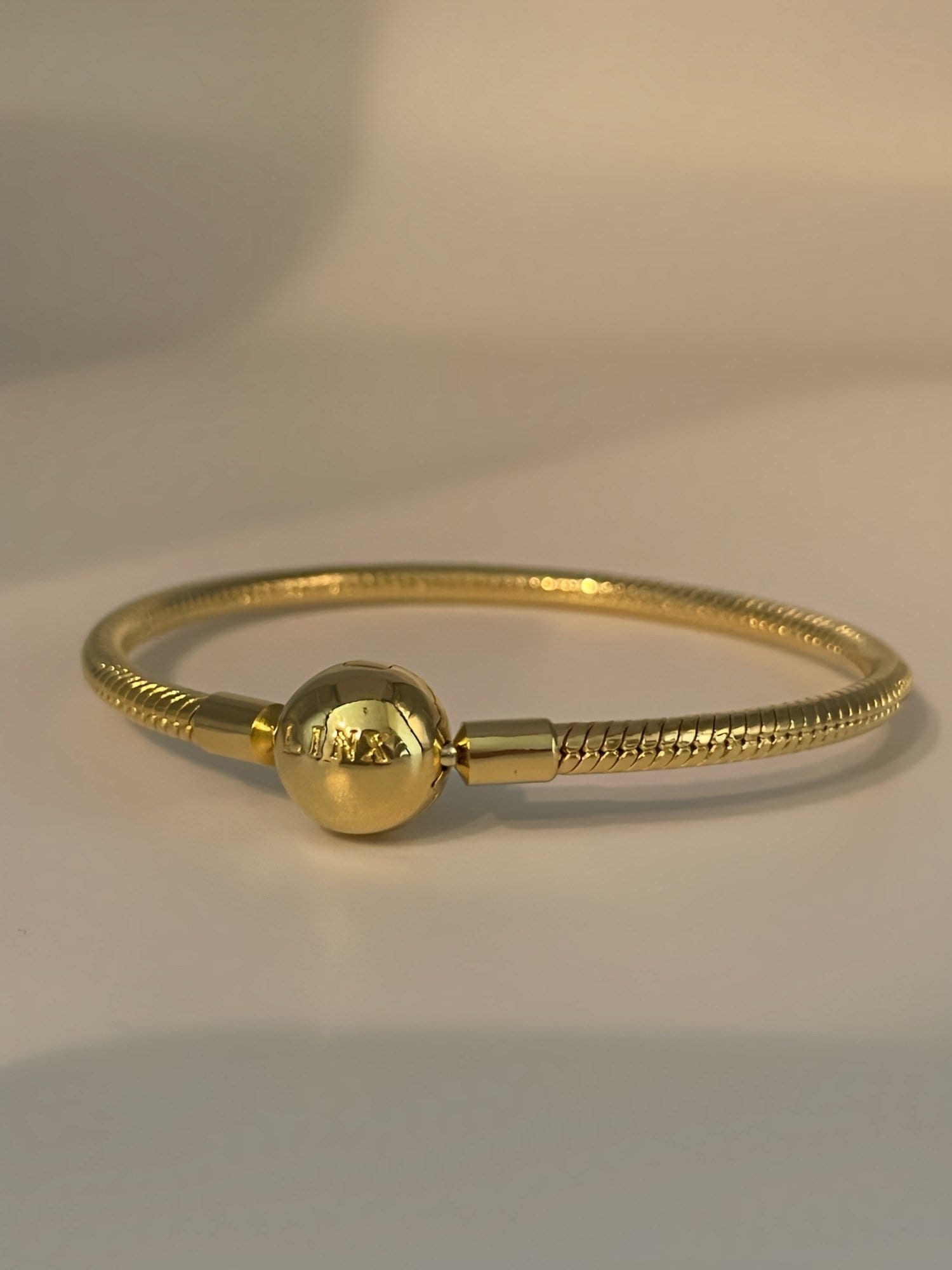 Linx Yellow Gold Snake Chain Bracelet With Gold and Silver  display picture 1