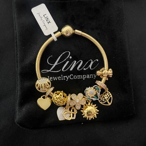 Linx Yellow Gold Snake Chain Bracelet with Gold Charms