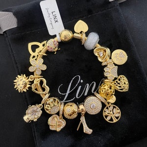 Linx Yellow Gold Snake Chain Bracelet with Gold Charms