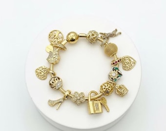 Linx Yellow Gold Snake Chain Bracelet with Gold Charms