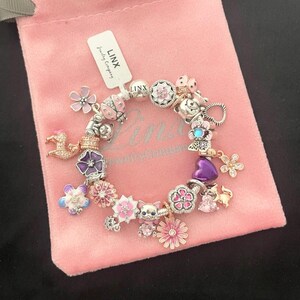 Linx Silver Snake Chain Bracelet with Pink Purple Silver and Rose Gold Themed Charms