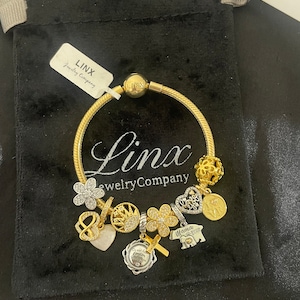 Linx Yellow Gold Snake Chain Bracelet with Silver and Yellow Gold Religious Mom Themed Charms