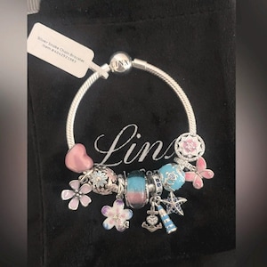 Linx Snake Chain Bracelet with Pale Pink and Baby Blue Themed Charms