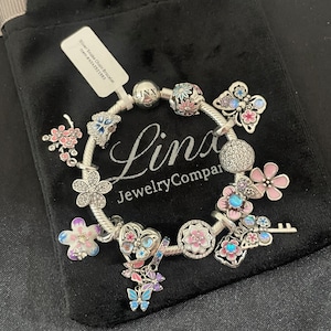 Linx Snake Chain Bracelet with Pale Pink and Baby Blue Themed Charms