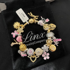 Linx Yellow Gold Snake Chain Bracelet with Pink and Gold Themed Charms