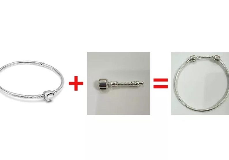 Puede incluir: Un brazalete de plata con un dije de plata adjunto. El brazalete est&aacute; hecho de peque&ntilde;os eslabones redondos. El dije es un peque&ntilde;o cilindro redondo con un dise&ntilde;o decorativo.