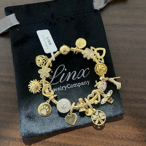 Linx Yellow Gold Snake Chain Bracelet with Gold Charms