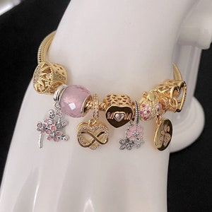 Linx Yellow Gold Snake Chain Bracelet with Pink Mom Themed Charms