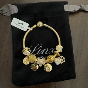 Linx Yellow Gold Snake Chain Bracelet with Gold Charms