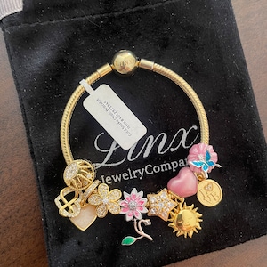 Linx Yellow Gold Snake Chain Bracelet with Gold and Pink Charms
