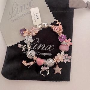 Linx Silver Snake Chain Bracelet with Pink Purple Silver and Rose Gold Themed Charms