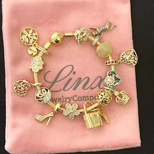 Linx Gelbgold Schlangenkette Armband mit Gold Charms