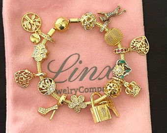 Linx Yellow Gold Snake Chain Bracelet with Gold Charms