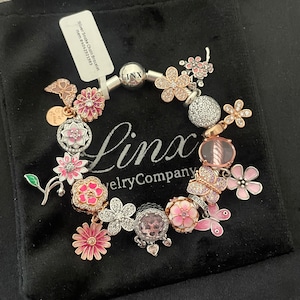 Linx Snake Chain Bracelet with Rose Gold Silver and Pink Butterfly and Flower Themed Charms