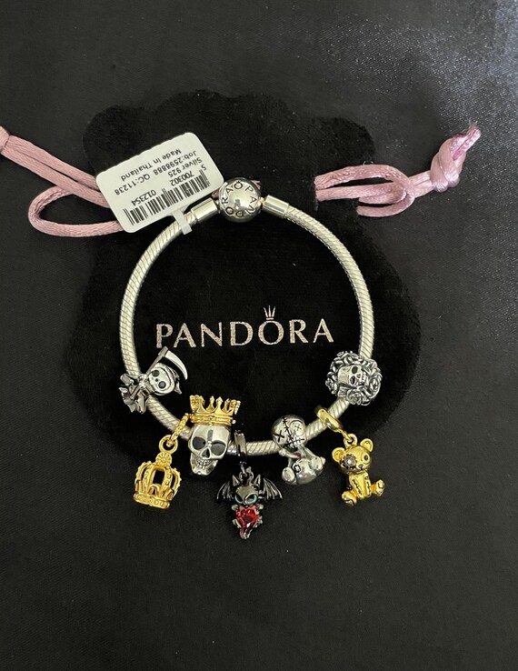 Pandora Bracelet With Gold, Black, and Silver Charms 