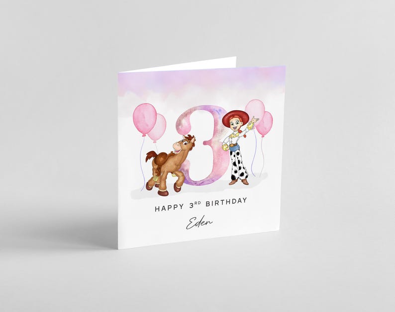 May include: A pink and purple watercolor birthday card with a cartoon image of a girl dressed as a cowgirl holding balloons. The number 3 is in the background with a horse beside the girl. The card says "Happy 3rd Birthday Eden".