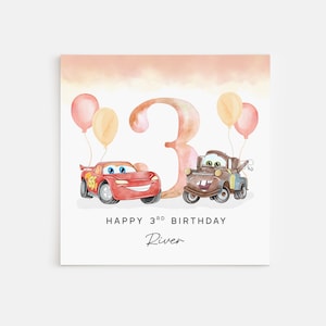 May include: A watercolor birthday card with a red car, a brown tow truck, and a large pink number 3. The card has a peach background and says "Happy 3rd Birthday River".