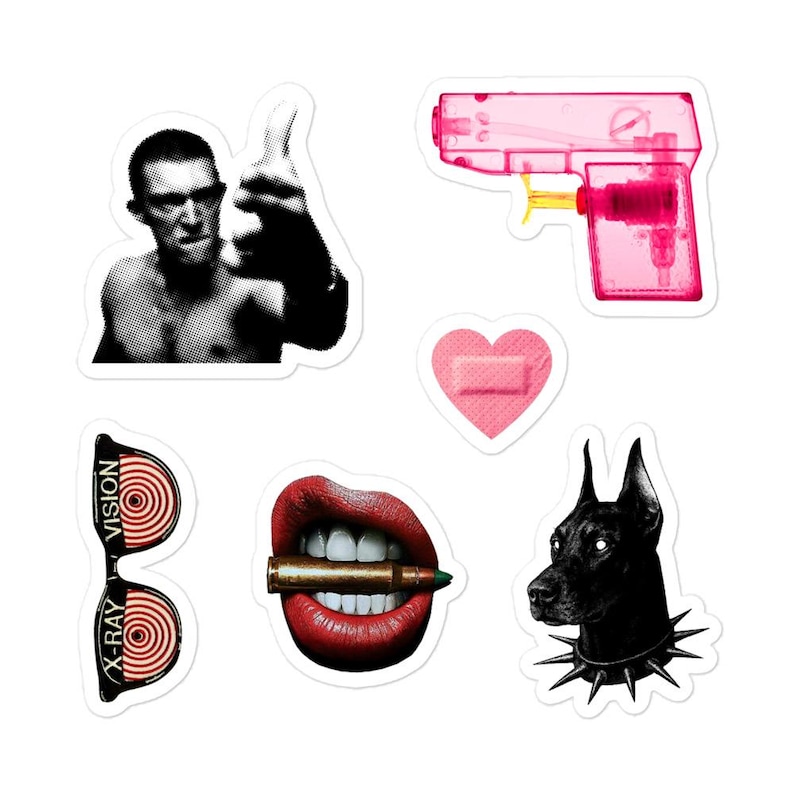 May include: A collection of stickers featuring various designs. Includes a black and white image of a person giving a thumbs up, a pink water gun, a pink heart bandage, sunglasses with "X-RAY VISION" text, red lips with a bullet, and a black dog with a spiked collar.
