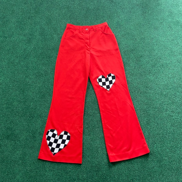 vintage 1970s wide leg flare pants by Lane Bryant - bright red polyester fabric w. black & white checkerboard heart appliqué patches