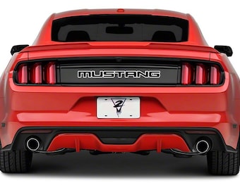 May include: Rear view of a red Ford Mustang with black trim and a black license plate with a white graphic. The car has a black rear spoiler and dual exhaust tips.