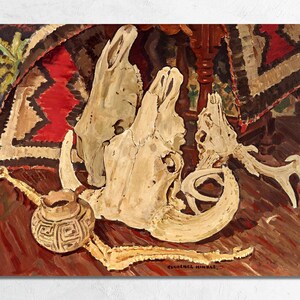 May include: An oil painting featuring animal skulls, a small pottery vessel, and a bone fragment on a dark brown surface. A patterned rug with red and black designs is in the background. The artist's signature is visible.