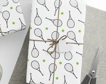 May include: Three white gift boxes with a black and green tennis racket and ball pattern. The boxes are tied with brown twine and have white gift tags attached.