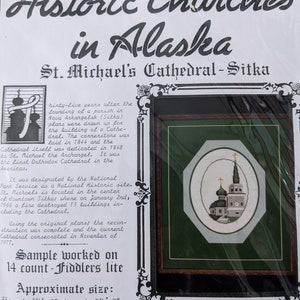 May include: Counted cross-stitch kit featuring a cross-stitch design of St. Michael's Cathedral in Sitka, Alaska. The kit includes the text "Historic Churches in Alaska" and "Alaskan Originals." The approximate size is 7 1/2" x 5" on 14 count cloth.