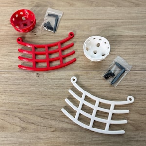 May include: Two sets of 3D printed wall-mounted planters. One set is red and the other is white. Each set includes a curved planter with a grid pattern and a round planter with holes.