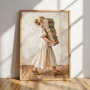 Puede incluir: Una impresión de arte mural enmarcada que muestra a una persona con cabello rubio recogido en un moño, vistiendo un vestido midi color crema con mangas abullonadas. La persona camina cargando una pila alta y vertical de libros de tapa dura.