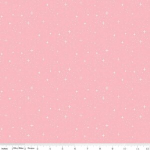 May include: A pink fabric with a white polka dot pattern. The dots are small and evenly spaced. The fabric is a light pink color.