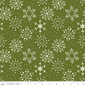 May include: A green fabric with a white snowflake pattern. The snowflakes are in various sizes and shapes, including stars and traditional snowflakes.