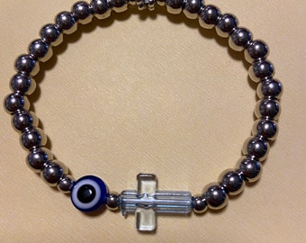 Beaded silver cross evil eye bracelet