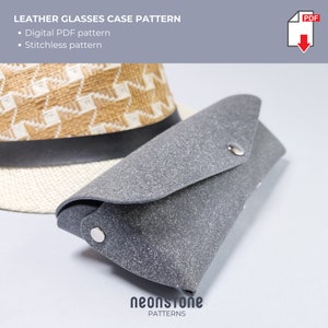 May include: A gray leather glasses case with a snap closure, next to a straw hat. The text "LEATHER GLASSES CASE PATTERN" is at the top, with "Digital PDF pattern" and "Stitchless pattern" below. The neonstone PATTERNS logo is at the bottom.