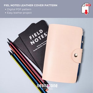 May include: A light pink leather notebook cover with a silver snap closure, a black Field Notes notebook, and several pencils. The image also includes the text "FIEL NOTES LEATHER COVER PATTERN" and "Digital PDF pattern".