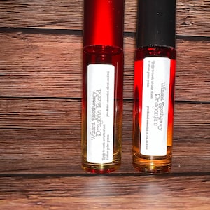 May include: Two 10 ml roll-on bottles of essential oil. The bottles are labelled "Wizard Apothecary Dragonfire" and "Wizard Apothecary Dragon's Blood".