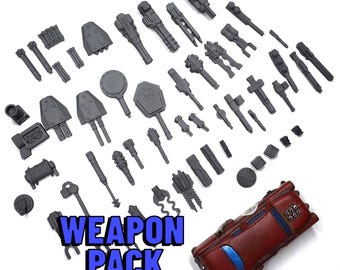 May include: A collection of gray miniature weapons and vehicle parts, including guns, hammers, and key-shaped items. A red car model is also present. The text "WEAPON PACK" is displayed in blue.