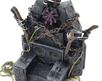 May include: A detailed, miniature throne sculpture. The throne is constructed from dark gray blocks, adorned with chains, and topped with a purple flag. The design incorporates speaker-like elements and a central floral emblem.