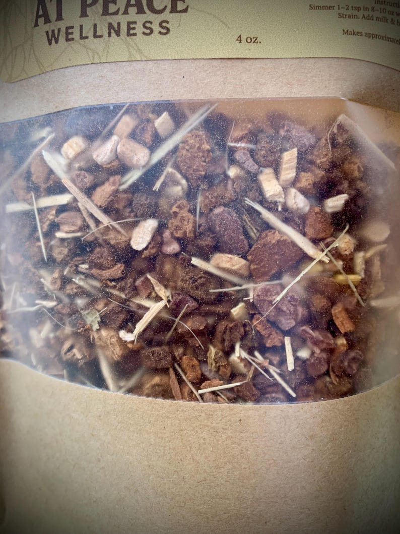 May include: A transparent bag containing a blend of dried herbs and spices. The label reads "AT PEACE WELLNESS" and "4 oz." The contents are a mix of brown, beige, and tan pieces, along with long, thin, straw-like elements. The bag is sealed.