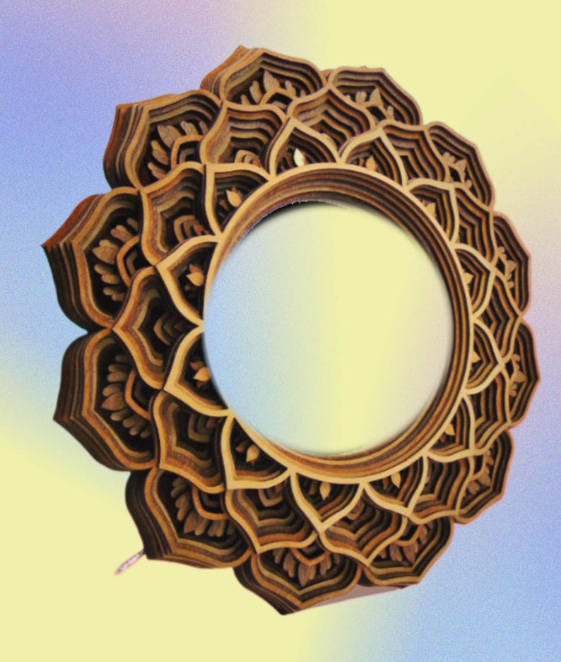 A round wooden mandala mirror with multi-layered petal designs against a blue and yellow gradient background.